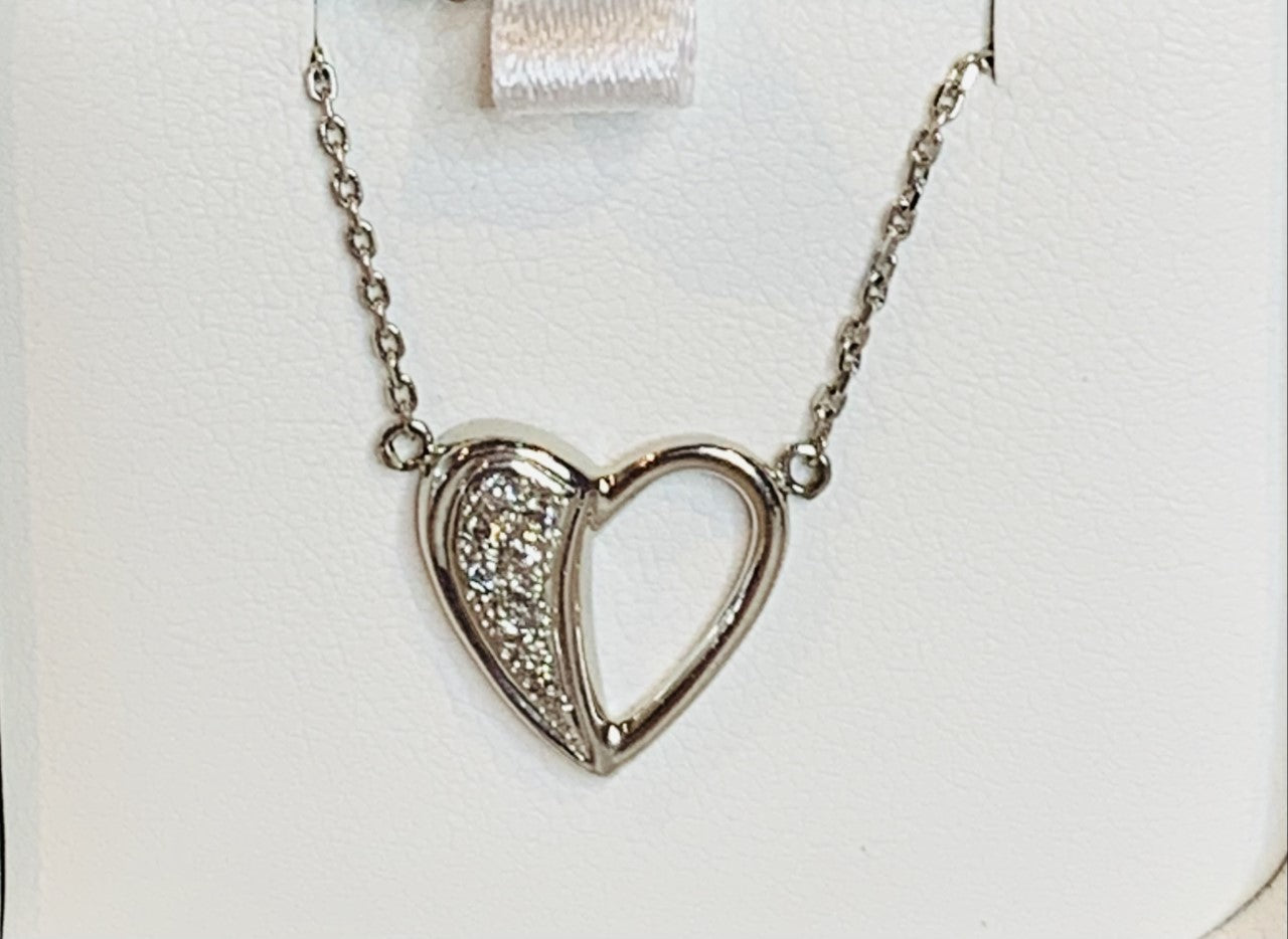 Platinum heart pendant with diamonds
