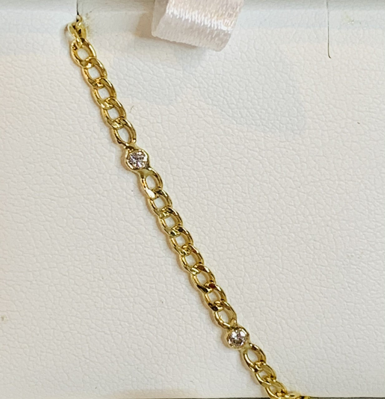 14k yellow gold Cuban link bracelet with diamonds